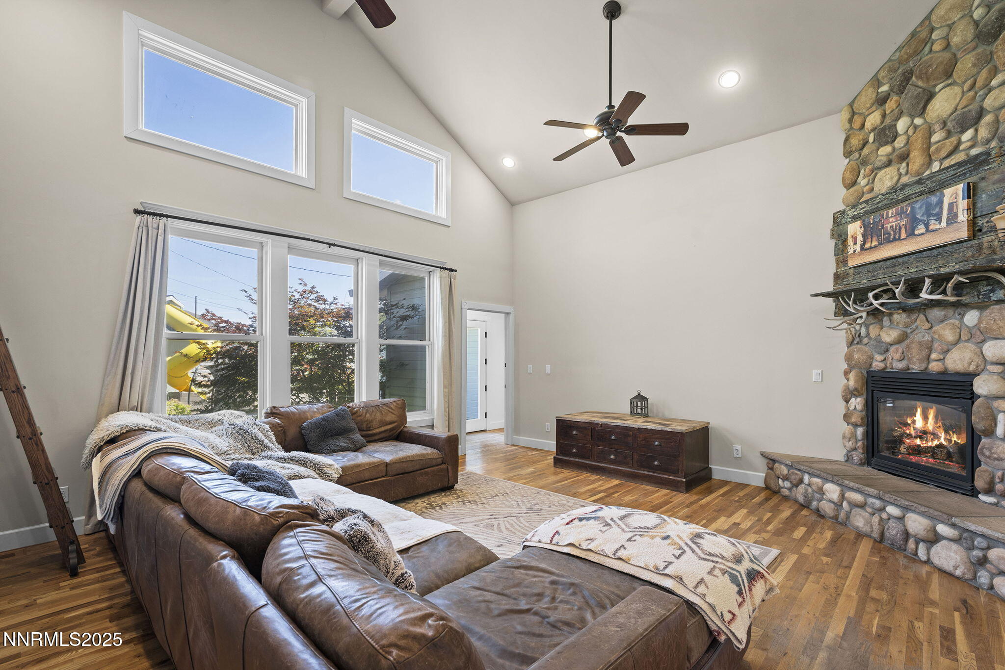 5 Connie Way Reno, NV 89521 - Photo 23 of 54 a bedroom with furniture and a fireplace