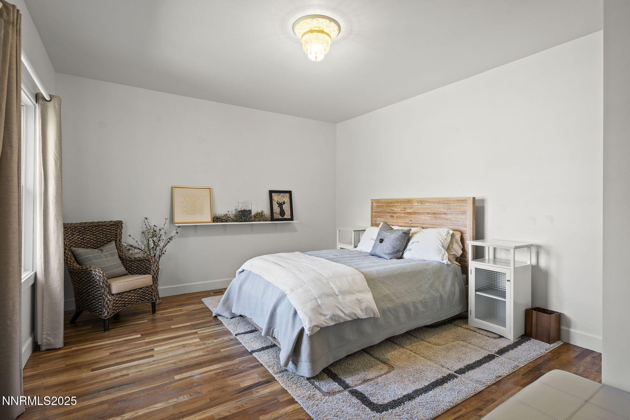 5 Connie Way Reno, NV 89521 - Photo 29 of 54 a bedroom with a bed and a lamp on dresser