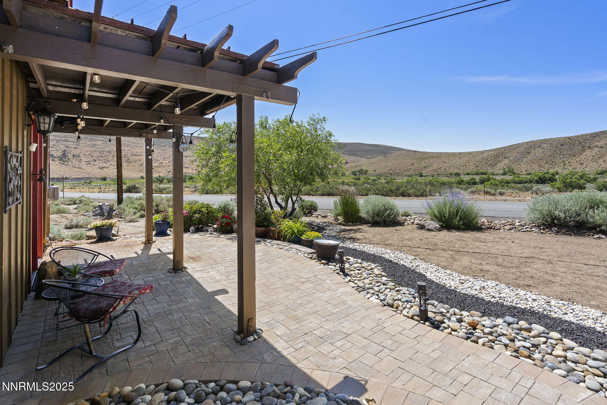 5 Connie Way Reno, NV 89521 - Photo 37 of 54 a view of a patio with a table chairs and a backyard