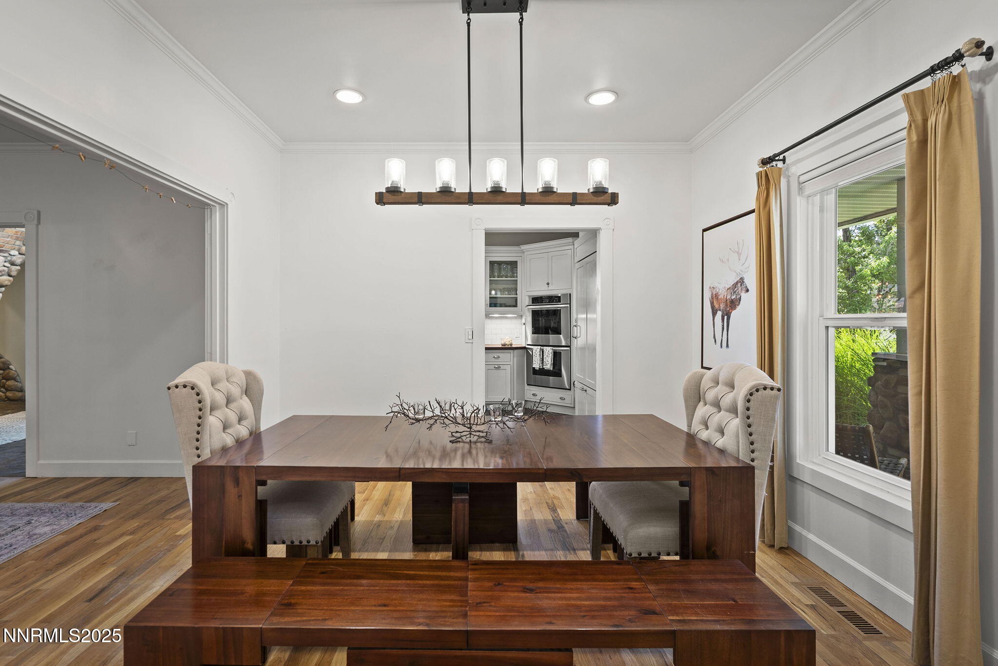 5 Connie Way Reno, NV 89521 - Photo 4 of 54 a view of a dining room with furniture window and wooden floor