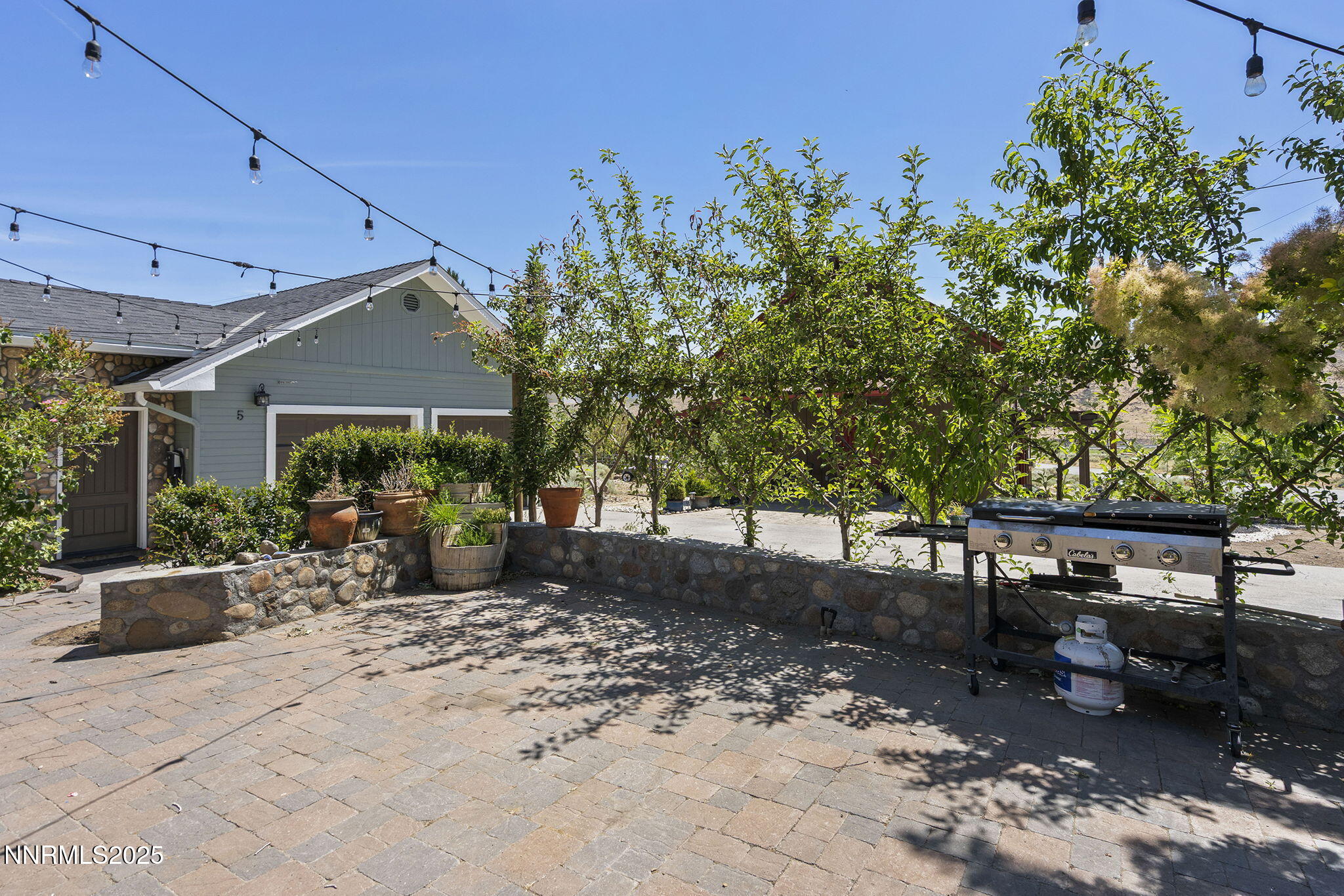 5 Connie Way Reno, NV 89521 - Photo 48 of 54 a view of a patio with table and chairs and potted plants