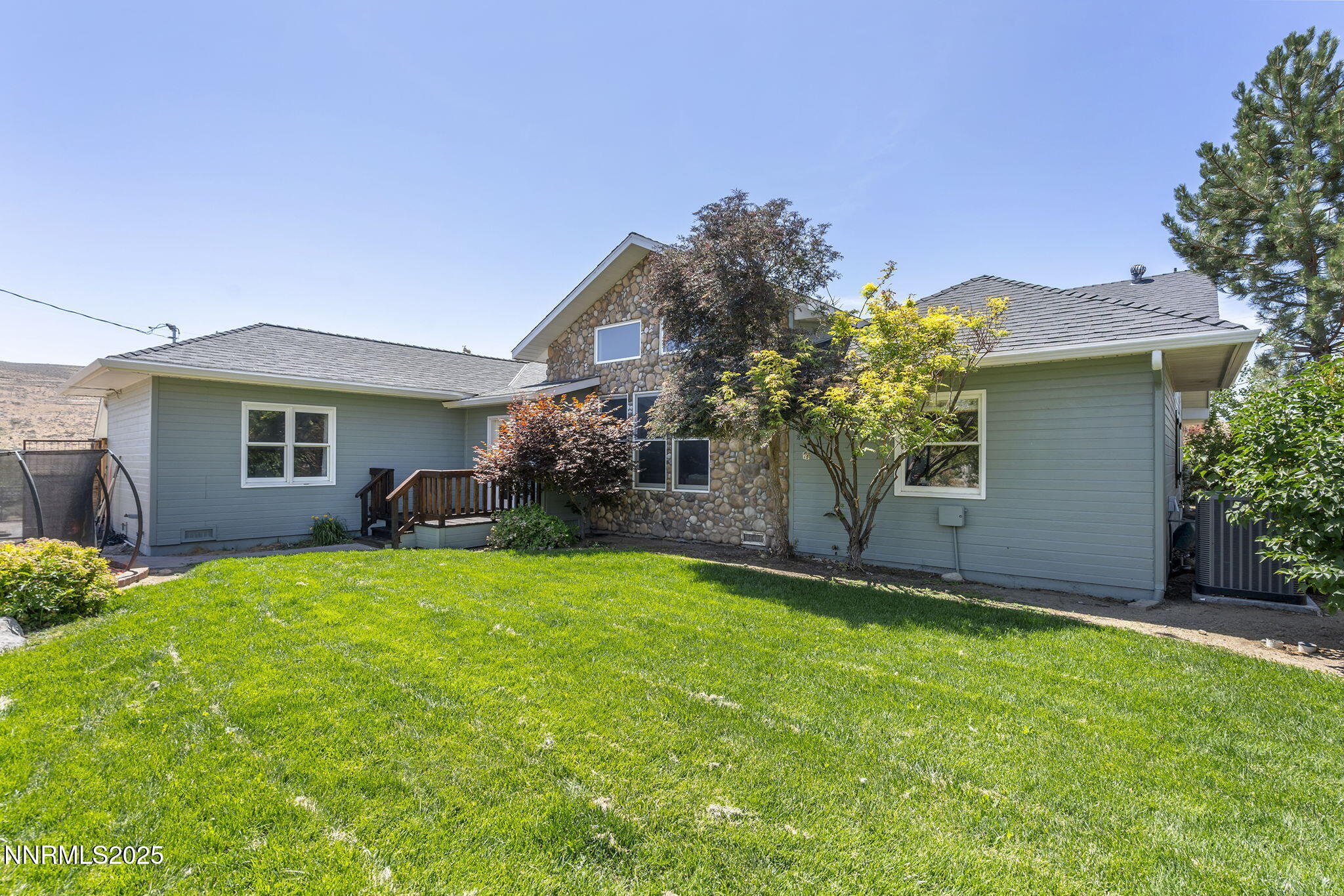 5 Connie Way Reno, NV 89521 - Photo 52 of 54 a front view of a house with a yard and garage