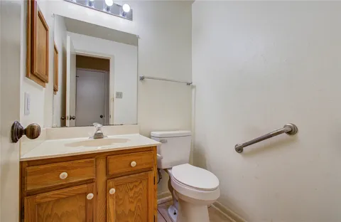 a spacious bathroom with a double vanity sink a mirror a bathtub and a shower