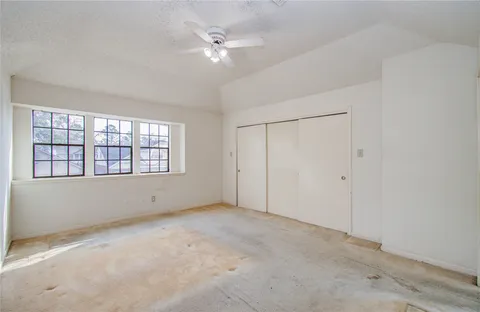 a spacious bathroom with a double vanity sink a mirror and a shower