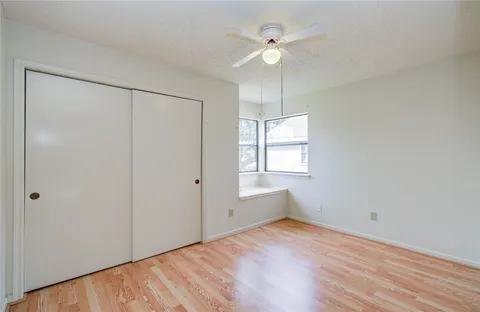 a view of a house with backyard and porch