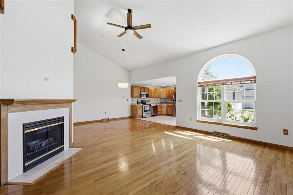 18 Castle Hills Road, Unit G Agawam, MA 01001 - Photo 14 of 39 a view of an empty room with a window and fireplace