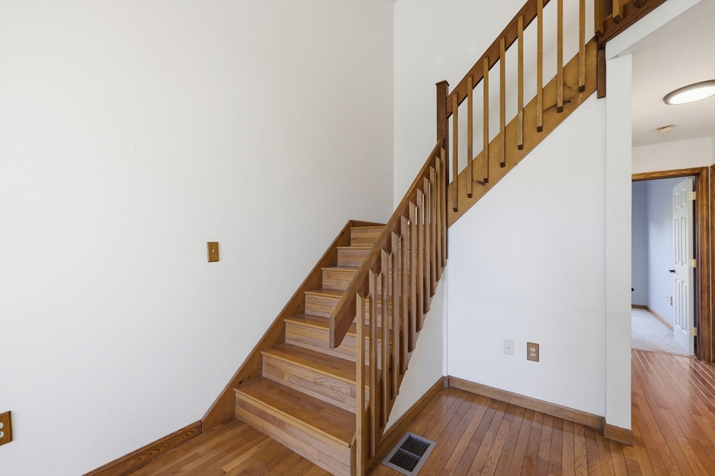 18 Castle Hills Road, Unit G Agawam, MA 01001 - Photo 26 of 39 a view of staircase with wooden floor and white walls