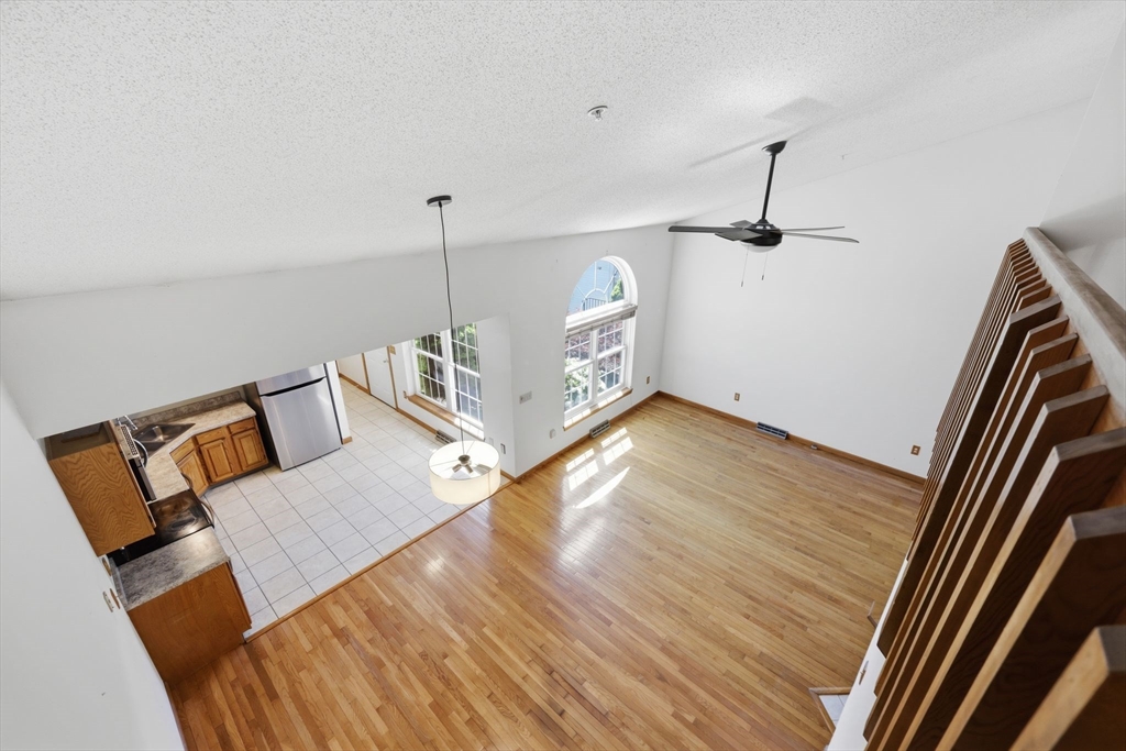 18 Castle Hills Road, Unit G Agawam, MA 01001 - Photo 30 of 39 a view of a room with wooden floor and ceiling fan