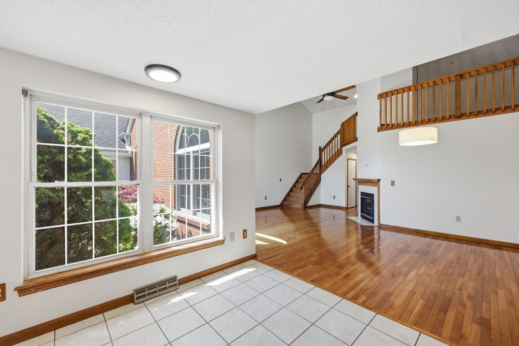 18 Castle Hills Road, Unit G Agawam, MA 01001 - Photo 8 of 39 a view of an entryway with wooden floor and windows