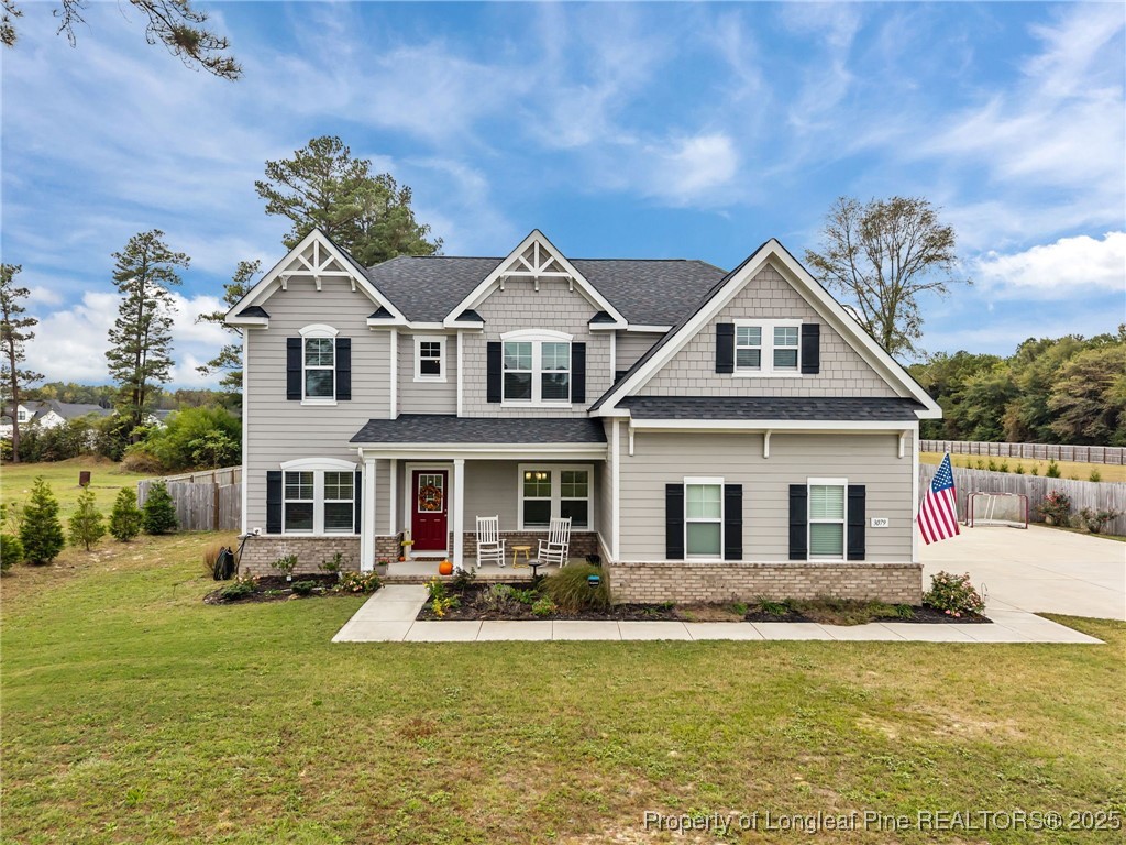 a front view of a house with swimming pool having outdoor seating