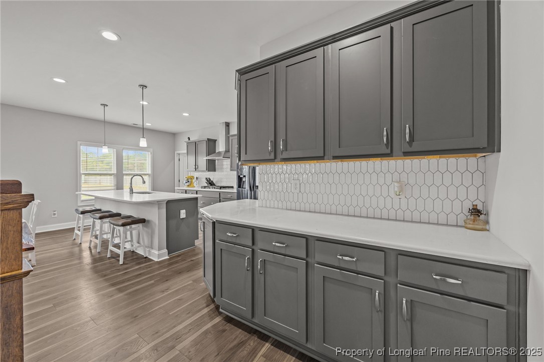 3079 Wade-Stedman Road Stedman, NC 28391 - Photo 11 of 50 a kitchen with a sink cabinets and wooden floor