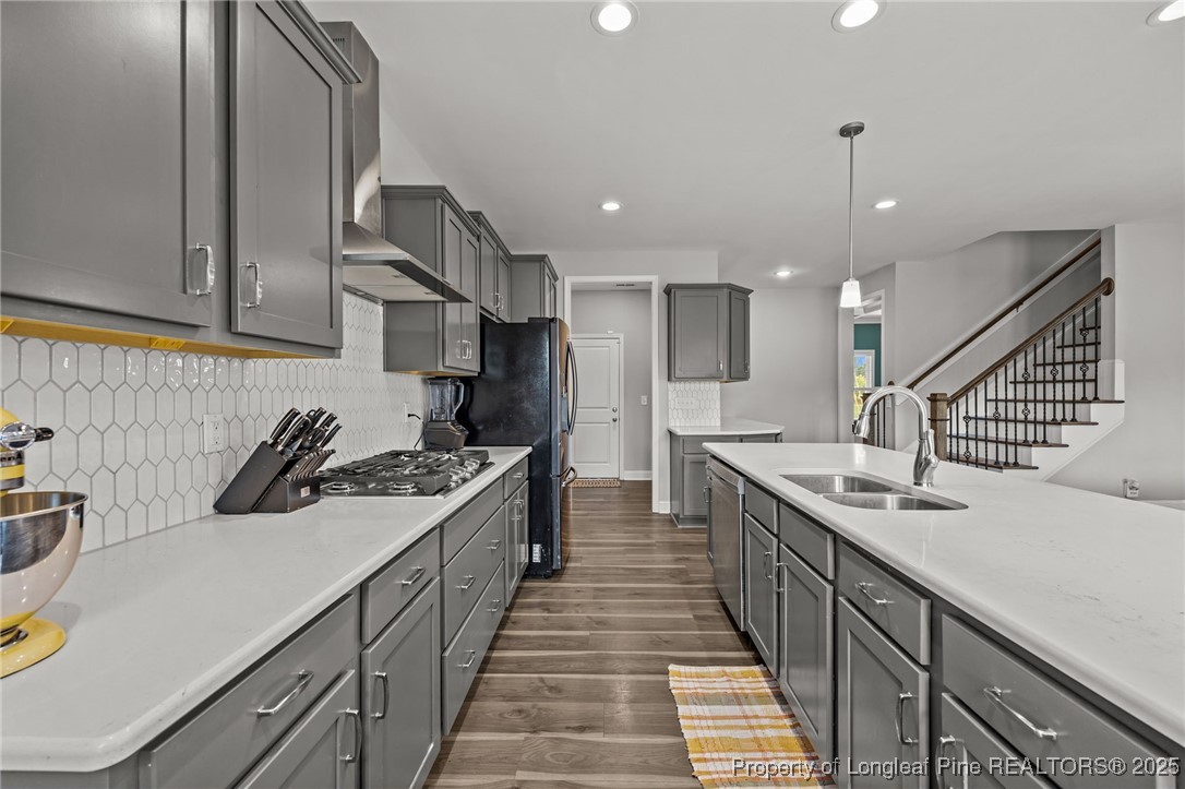 3079 Wade-Stedman Road Stedman, NC 28391 - Photo 13 of 50 a kitchen with a sink a stove and cabinets
