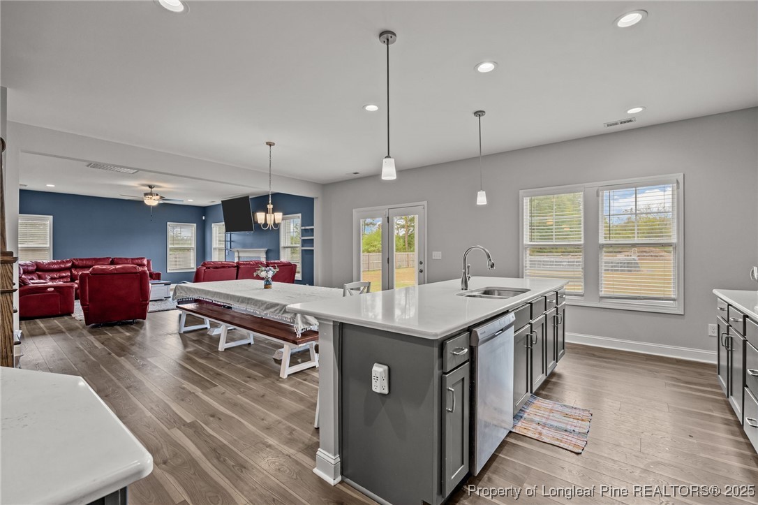 3079 Wade-Stedman Road Stedman, NC 28391 - Photo 15 of 50 a large kitchen with kitchen island a sink stove and a refrigerator