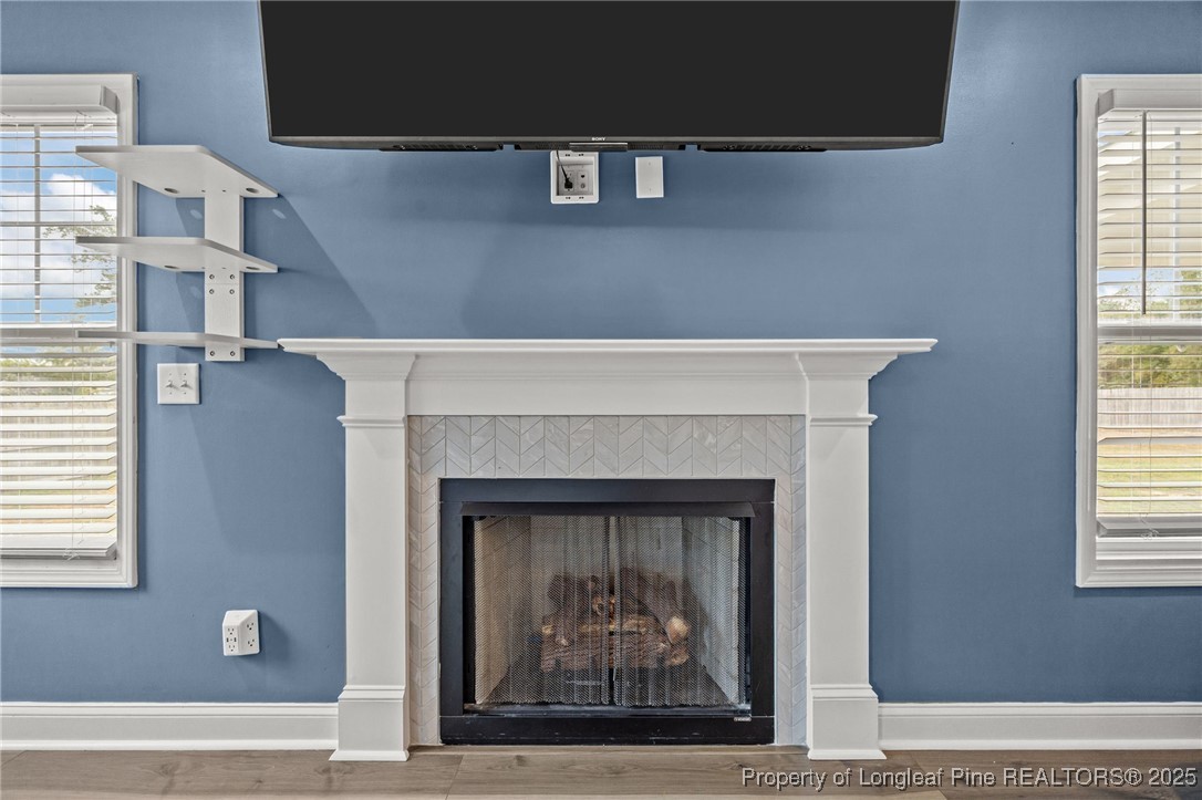 3079 Wade-Stedman Road Stedman, NC 28391 - Photo 19 of 50 a living room with a fireplace and a window