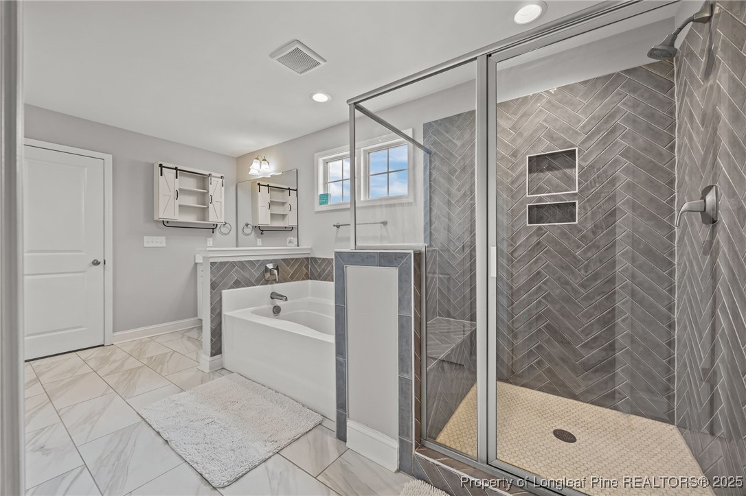 3079 Wade-Stedman Road Stedman, NC 28391 - Photo 33 of 50 a bathroom with a shower a sink and a mirror