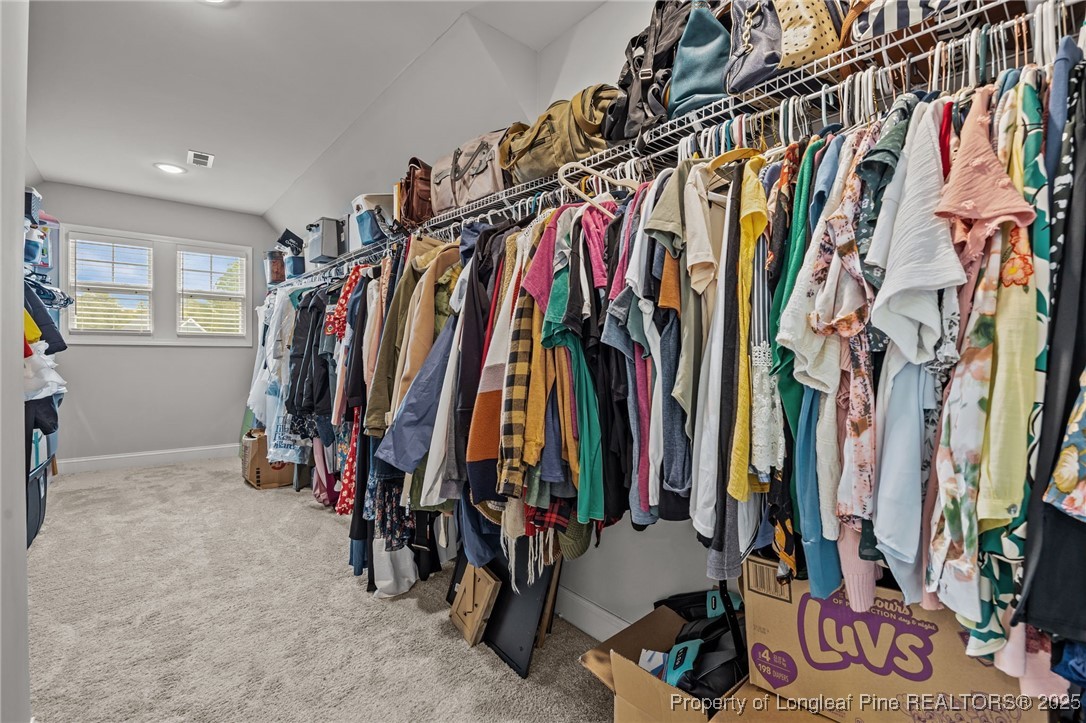 3079 Wade-Stedman Road Stedman, NC 28391 - Photo 34 of 50 a view of walk in closet with clothes