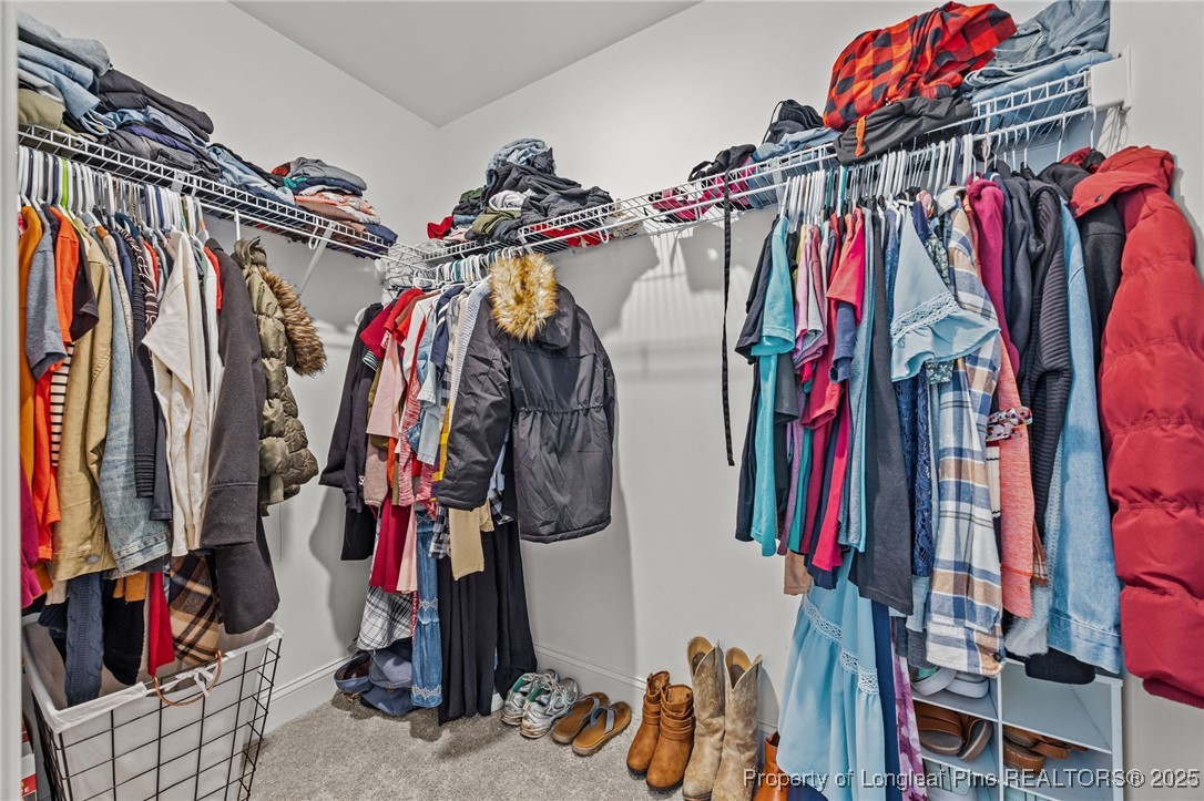 3079 Wade-Stedman Road Stedman, NC 28391 - Photo 38 of 50 a view of walk in closet with clothes