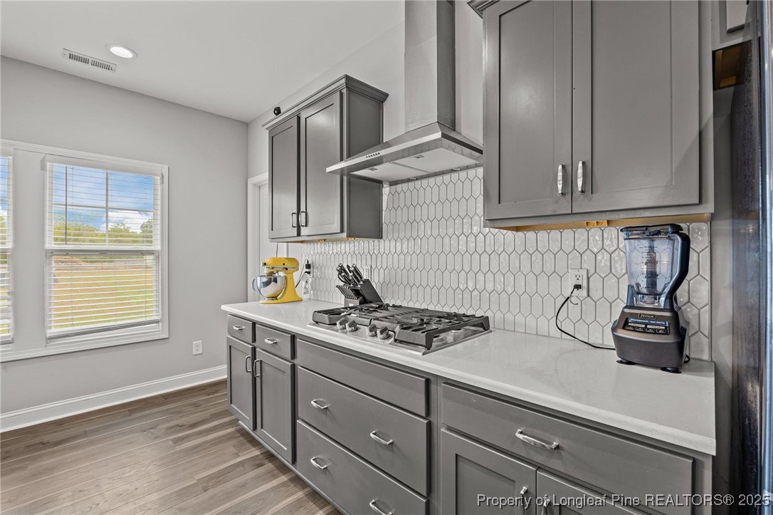 3079 Wade-Stedman Road Stedman, NC 28391 - Photo 10 of 50 a kitchen with stainless steel appliances a cabinets and a stove top oven