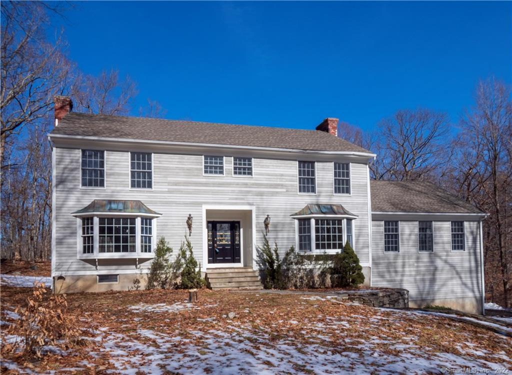 44 Hackberry Hill Road Weston, CT 06883 - Photo 1 of 1 a front view of a house with a yard