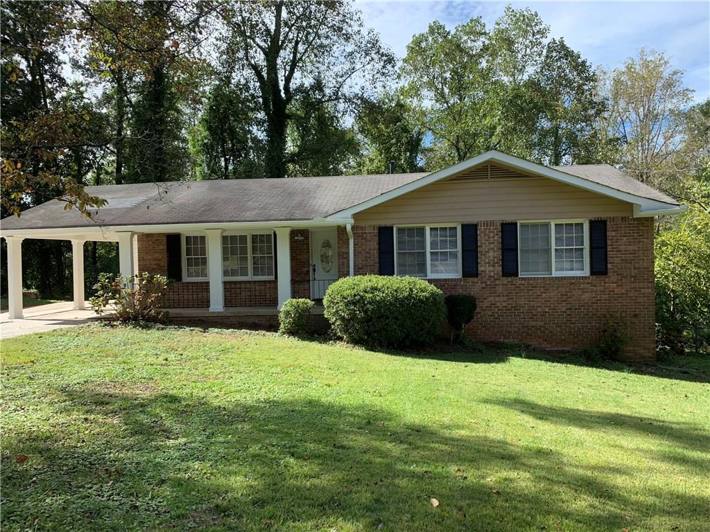 367 River Road Jonesboro, GA 30236 - Photo 1 of 1 a front view of a house with a yard