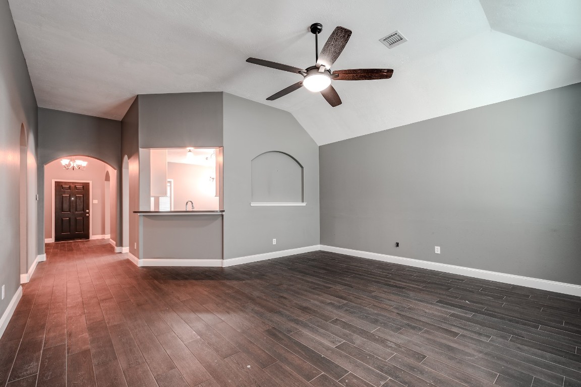8515 Holly Spring Lane Baytown, TX 77523 - Photo 11 of 28 Looking towards the entry from the back door area in the living room. Fresh paint throughout the home.