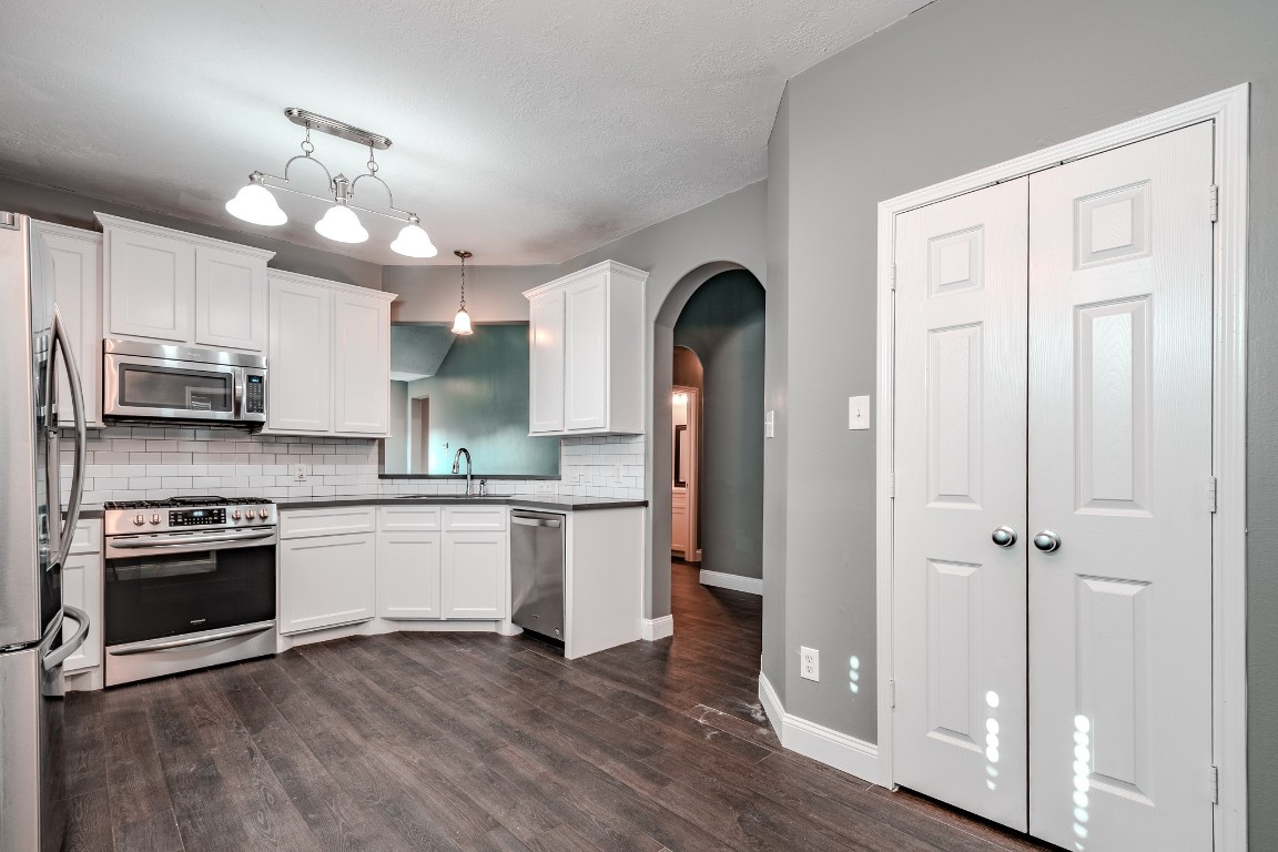 8515 Holly Spring Lane Baytown, TX 77523 - Photo 13 of 28 Double doors in the kitchen open to the oversized pantry.