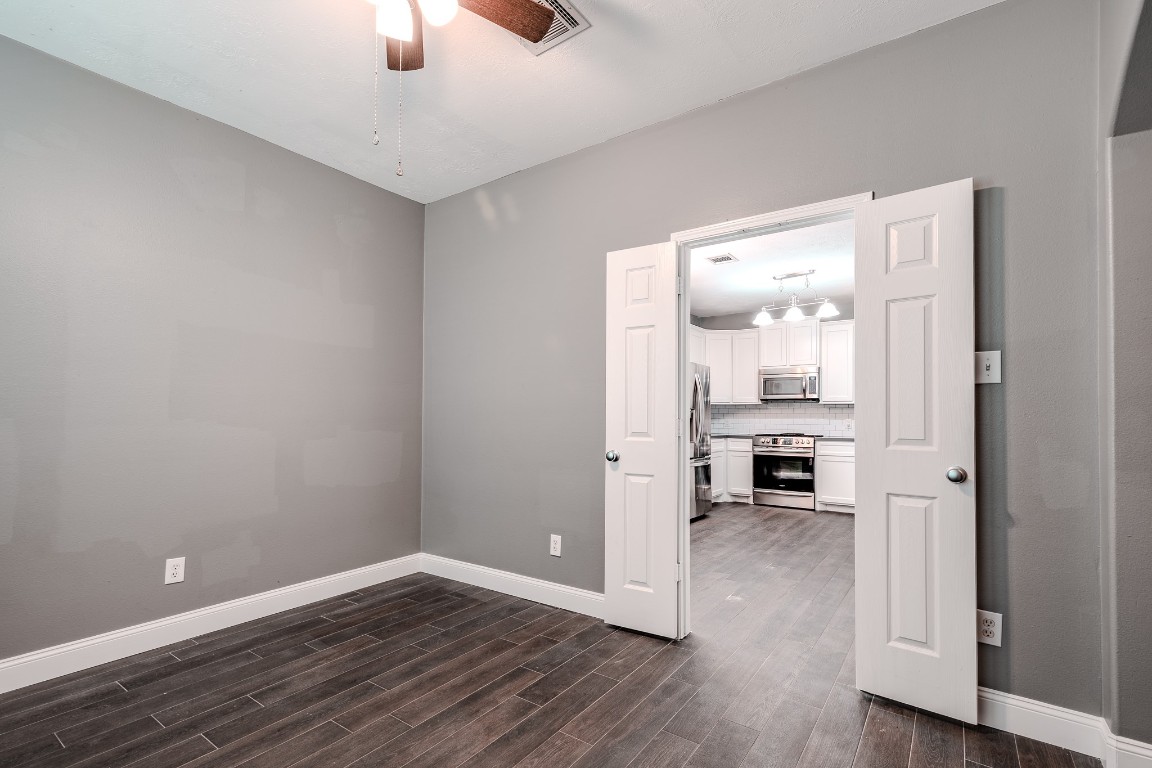 8515 Holly Spring Lane Baytown, TX 77523 - Photo 14 of 28 Dining room space looking into the kitchen.