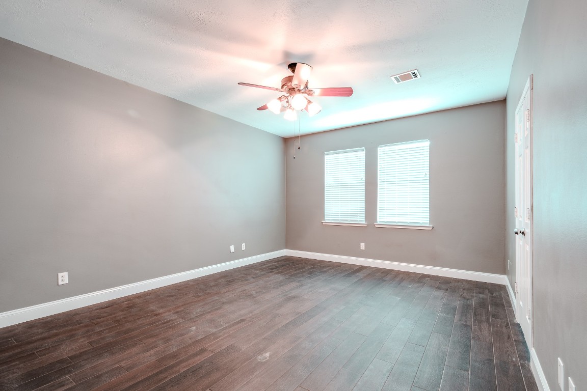 8515 Holly Spring Lane Baytown, TX 77523 - Photo 15 of 28 Primary bedroom offers room for all of your furniture.