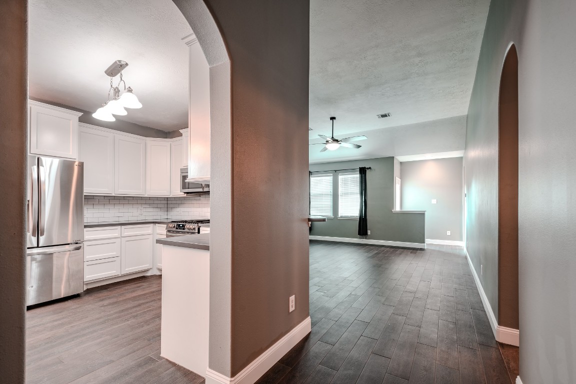 8515 Holly Spring Lane Baytown, TX 77523 - Photo 9 of 28 A look at the recently remodeled kitchen and into the large family room.