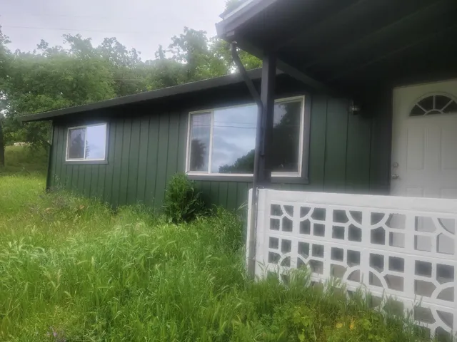 a backyard of a house with lots of green space