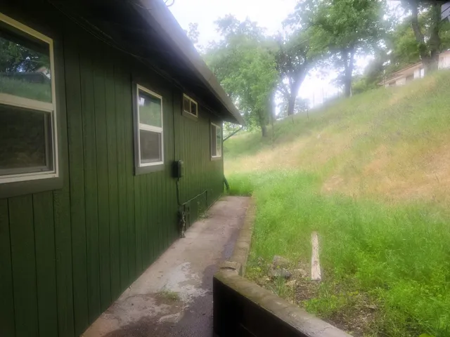 a view of a yard from a balcony