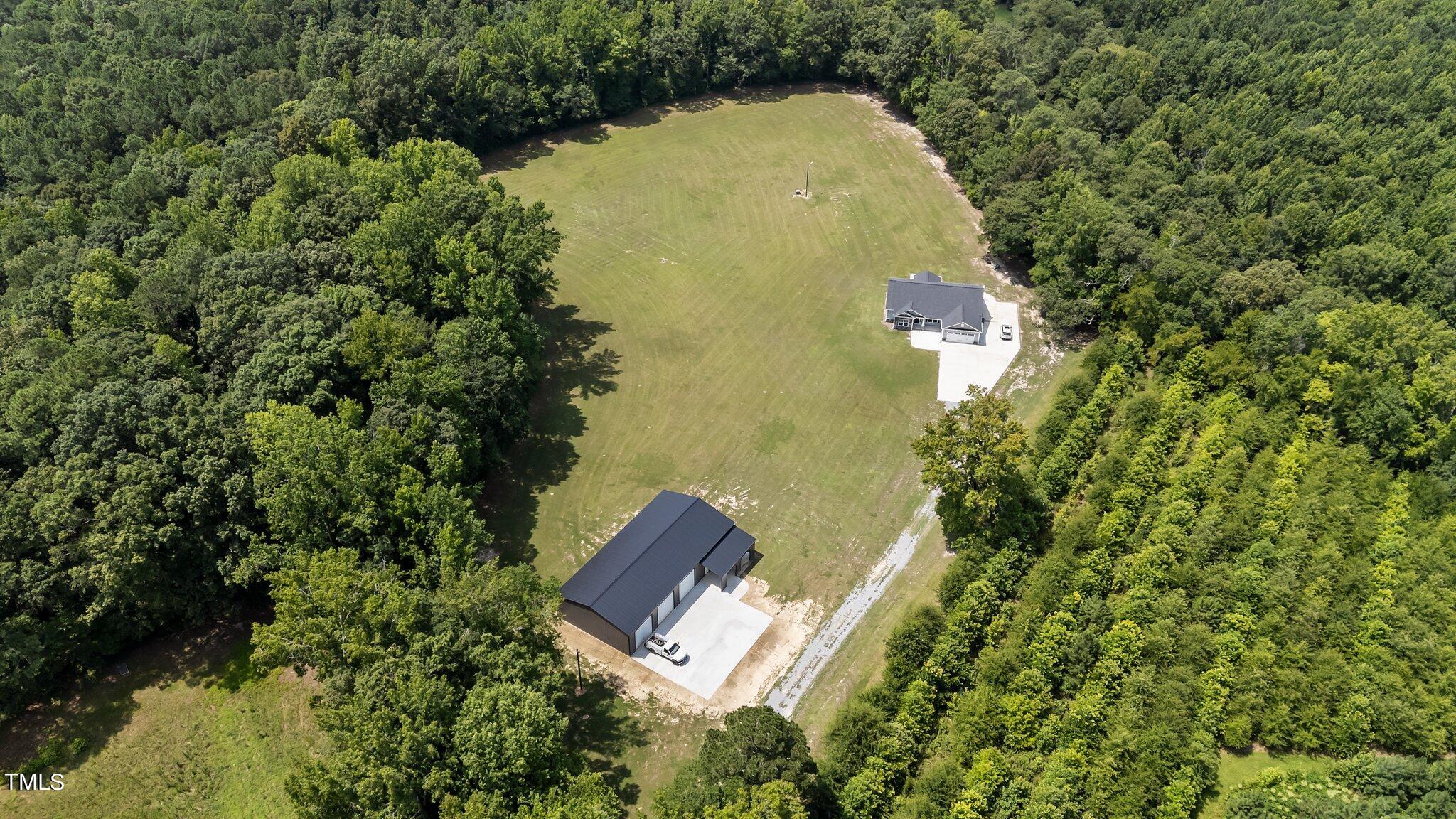 7588 Sadie Road Kenly, NC 27542 - Photo 1 of 58 an aerial view of a house with a yard