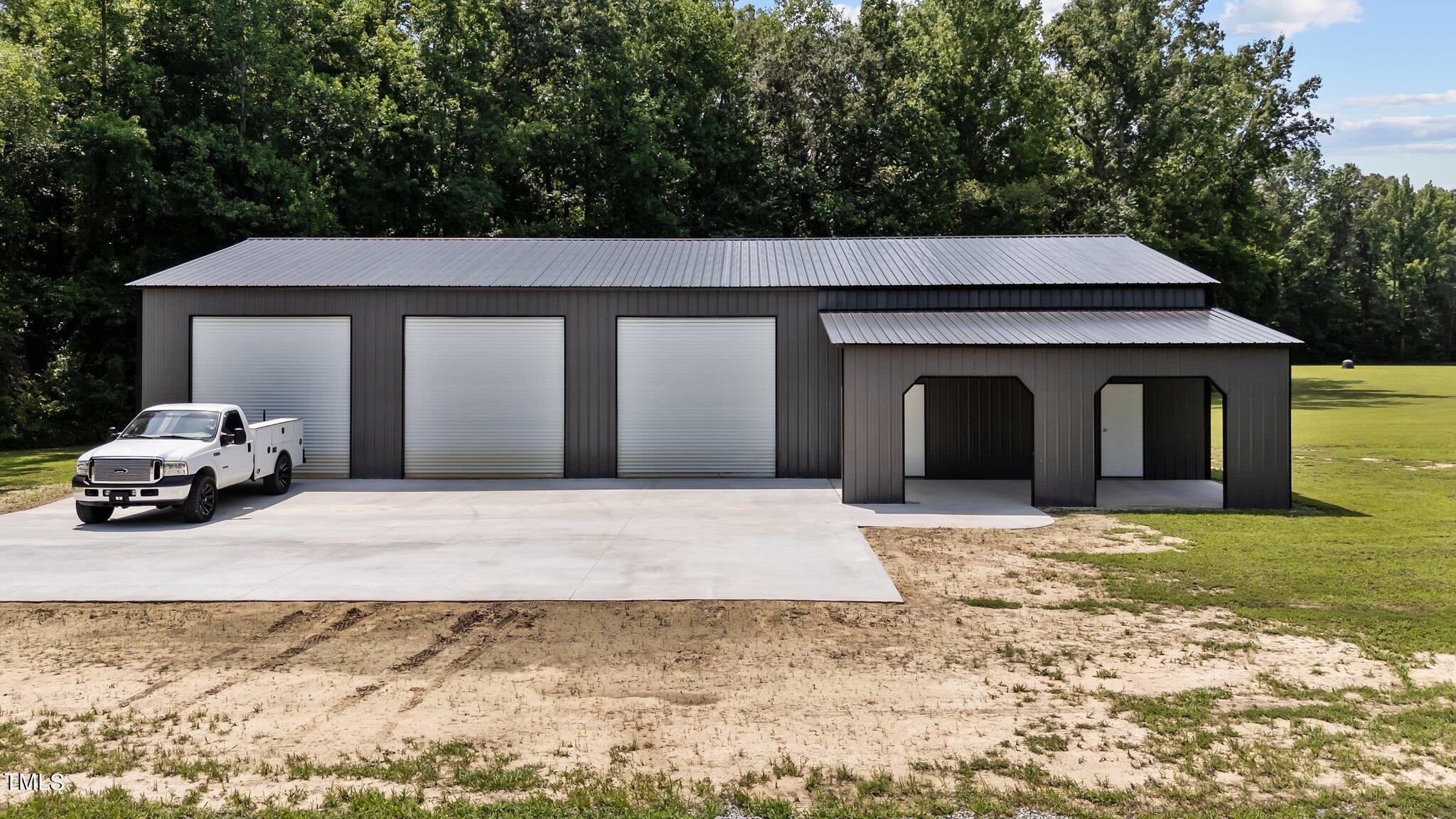 7588 Sadie Road Kenly, NC 27542 - Photo 12 of 58 a front view of a house with a yard
