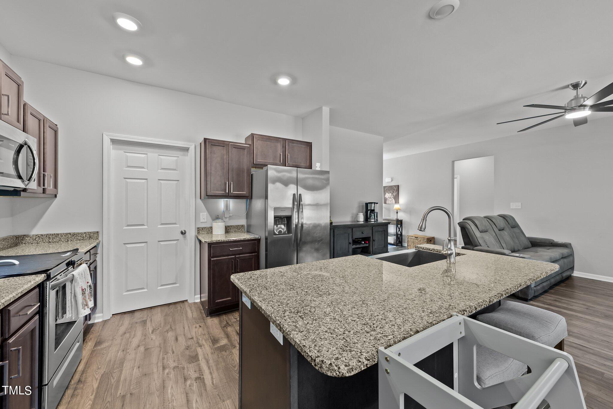 7588 Sadie Road Kenly, NC 27542 - Photo 34 of 58 a kitchen with a table and chairs in it