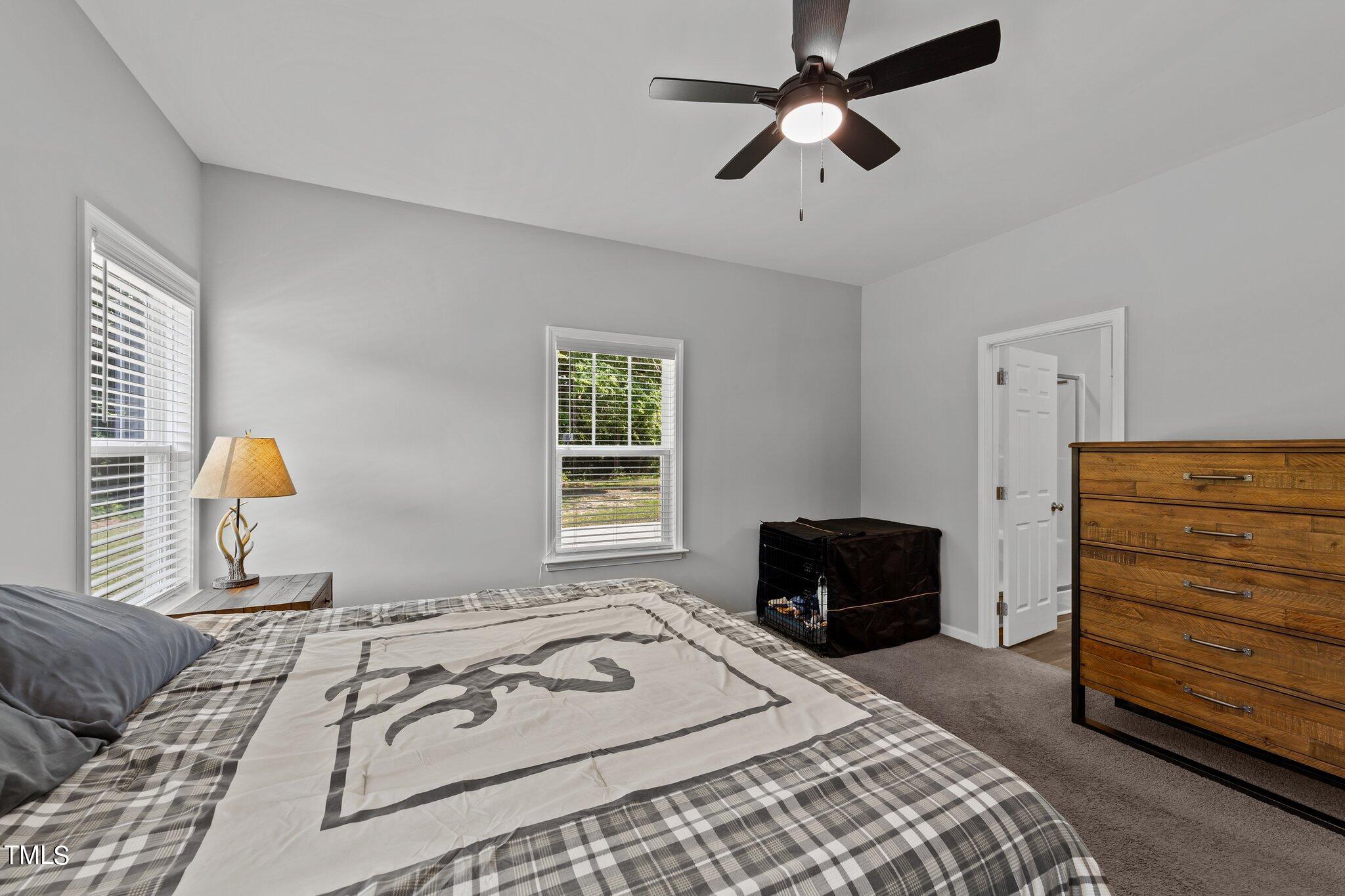 7588 Sadie Road Kenly, NC 27542 - Photo 40 of 58 a bedroom with a bed and a dresser