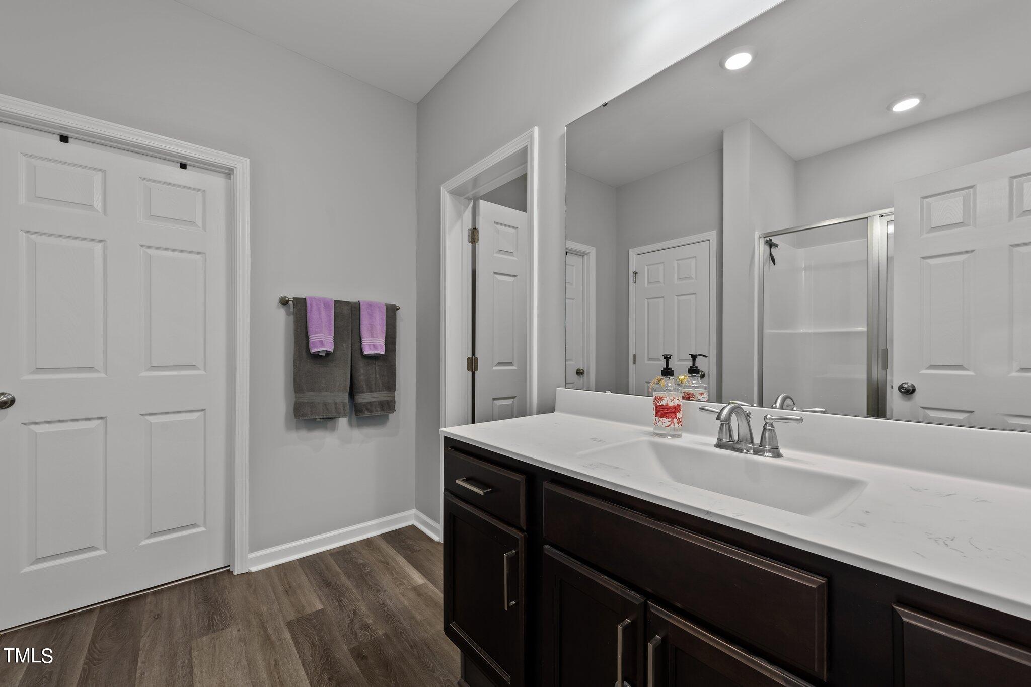 7588 Sadie Road Kenly, NC 27542 - Photo 42 of 58 a bathroom with a sink and a mirror