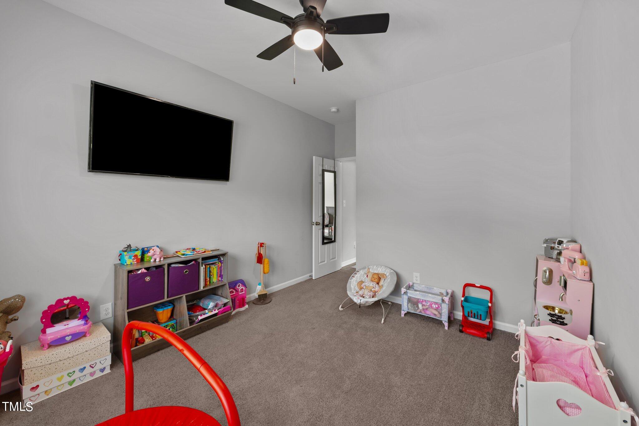 7588 Sadie Road Kenly, NC 27542 - Photo 45 of 58 a living room with furniture and a flat screen tv