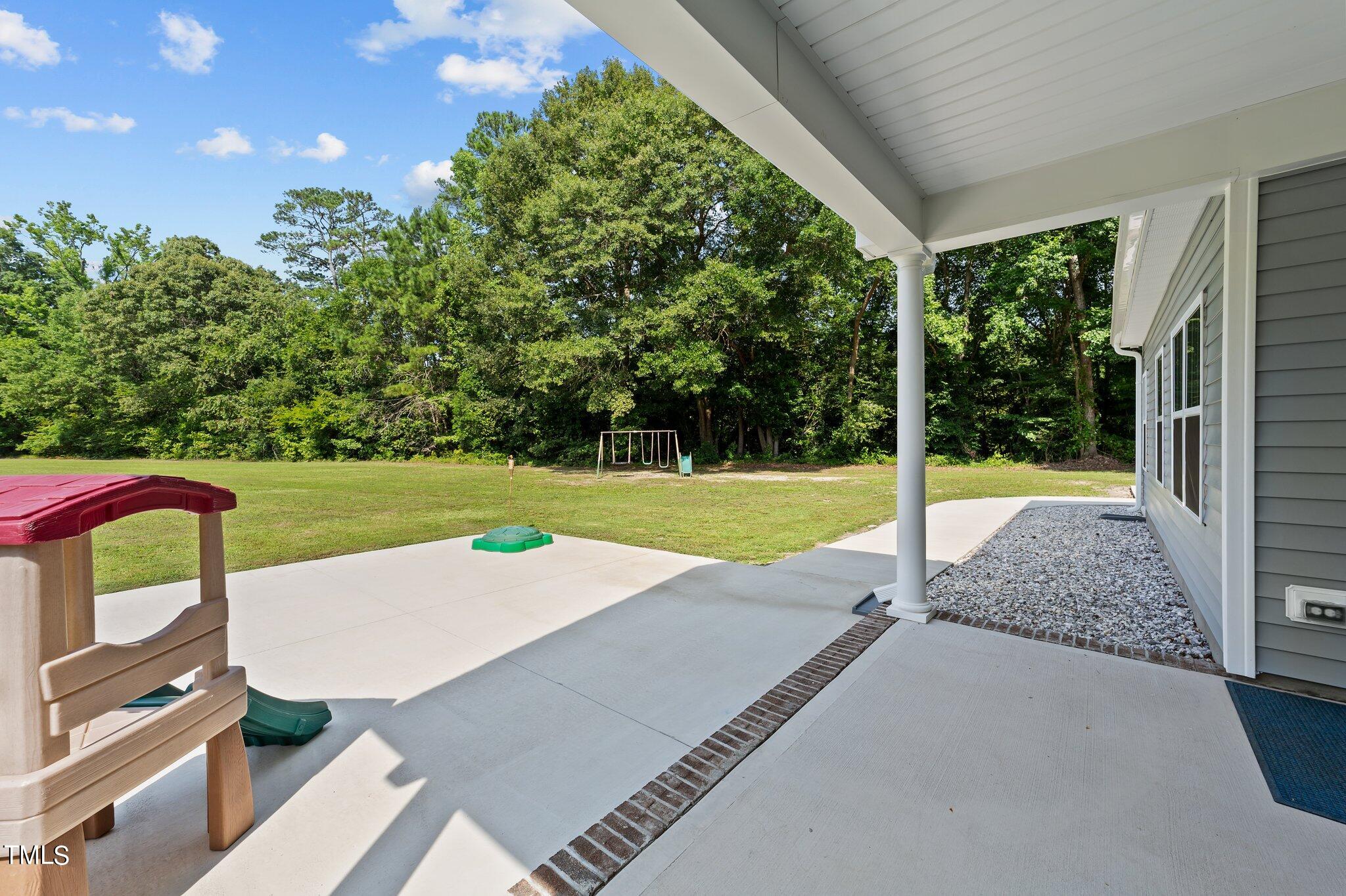 7588 Sadie Road Kenly, NC 27542 - Photo 52 of 58 a view of a backyard with swimming pool