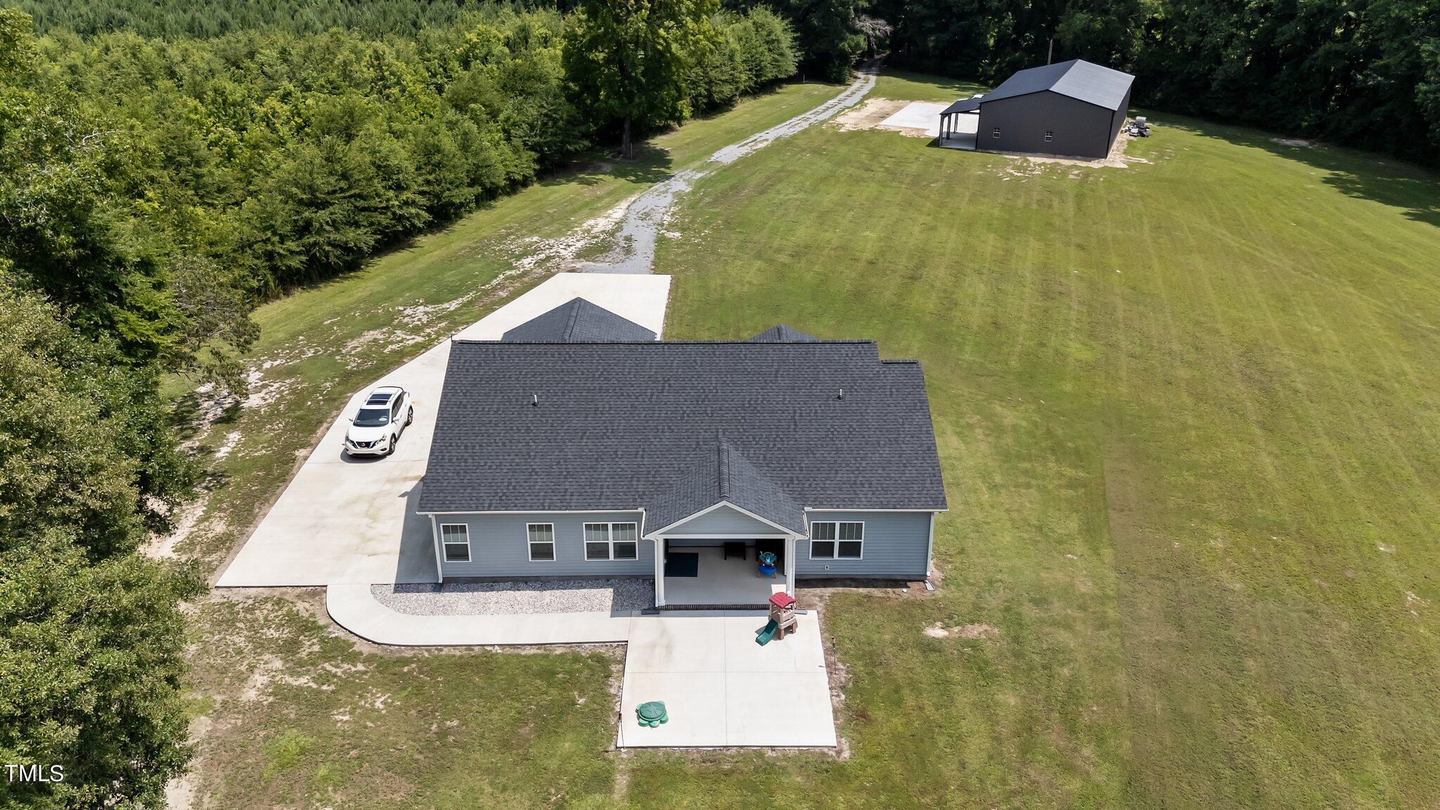 7588 Sadie Road Kenly, NC 27542 - Photo 55 of 58 a aerial view of a house with a yard