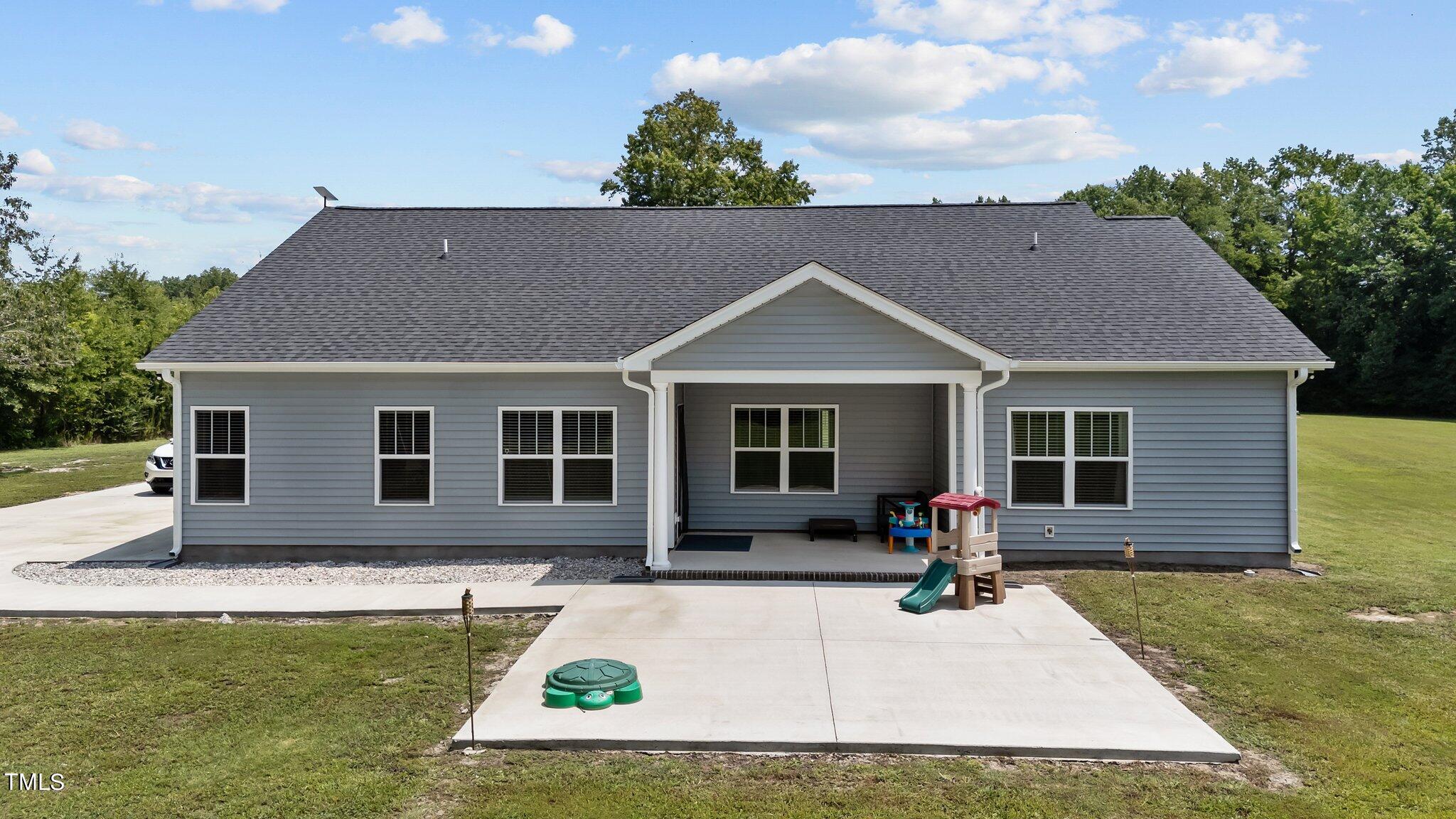 7588 Sadie Road Kenly, NC 27542 - Photo 56 of 58 a front view of a house with a yard