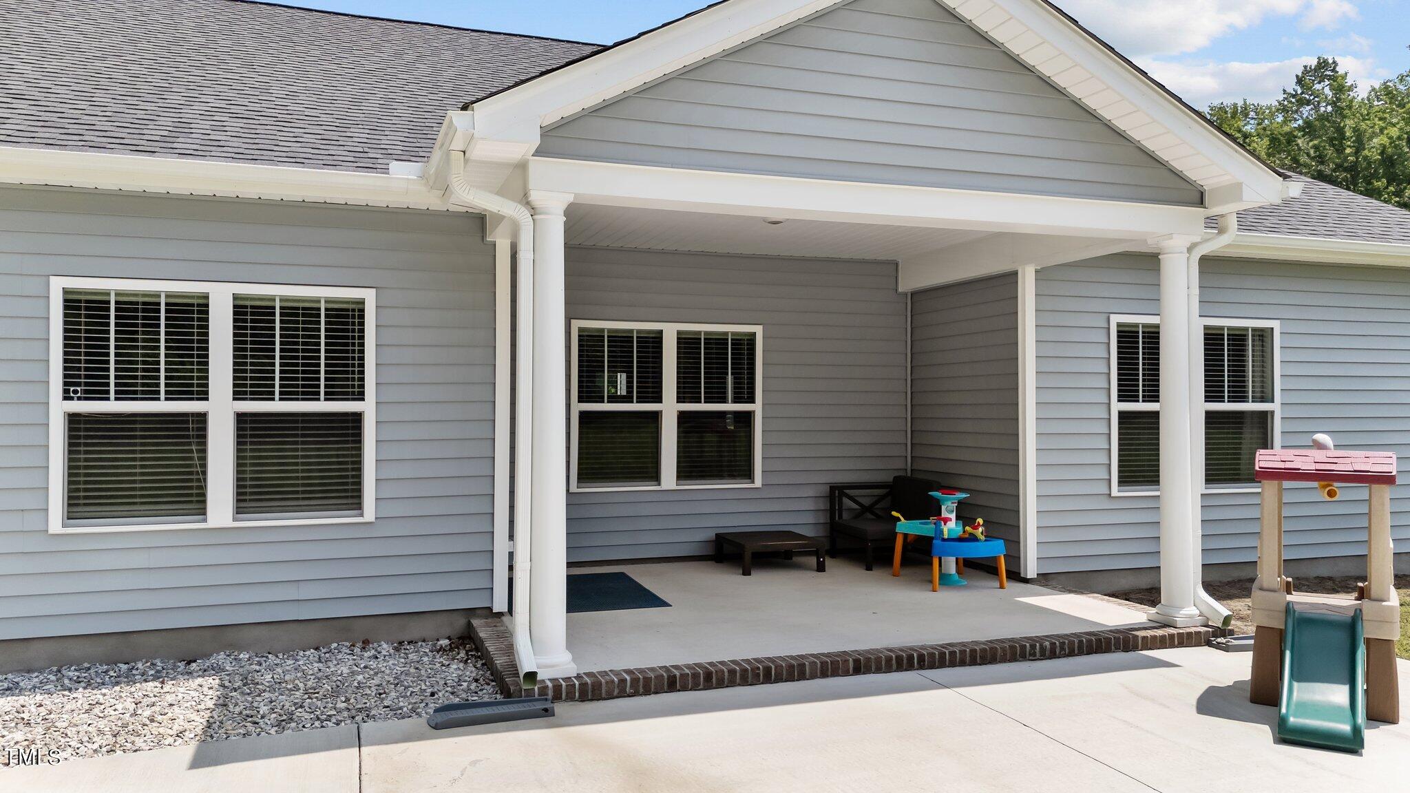 7588 Sadie Road Kenly, NC 27542 - Photo 57 of 58 a front view of a house with garden