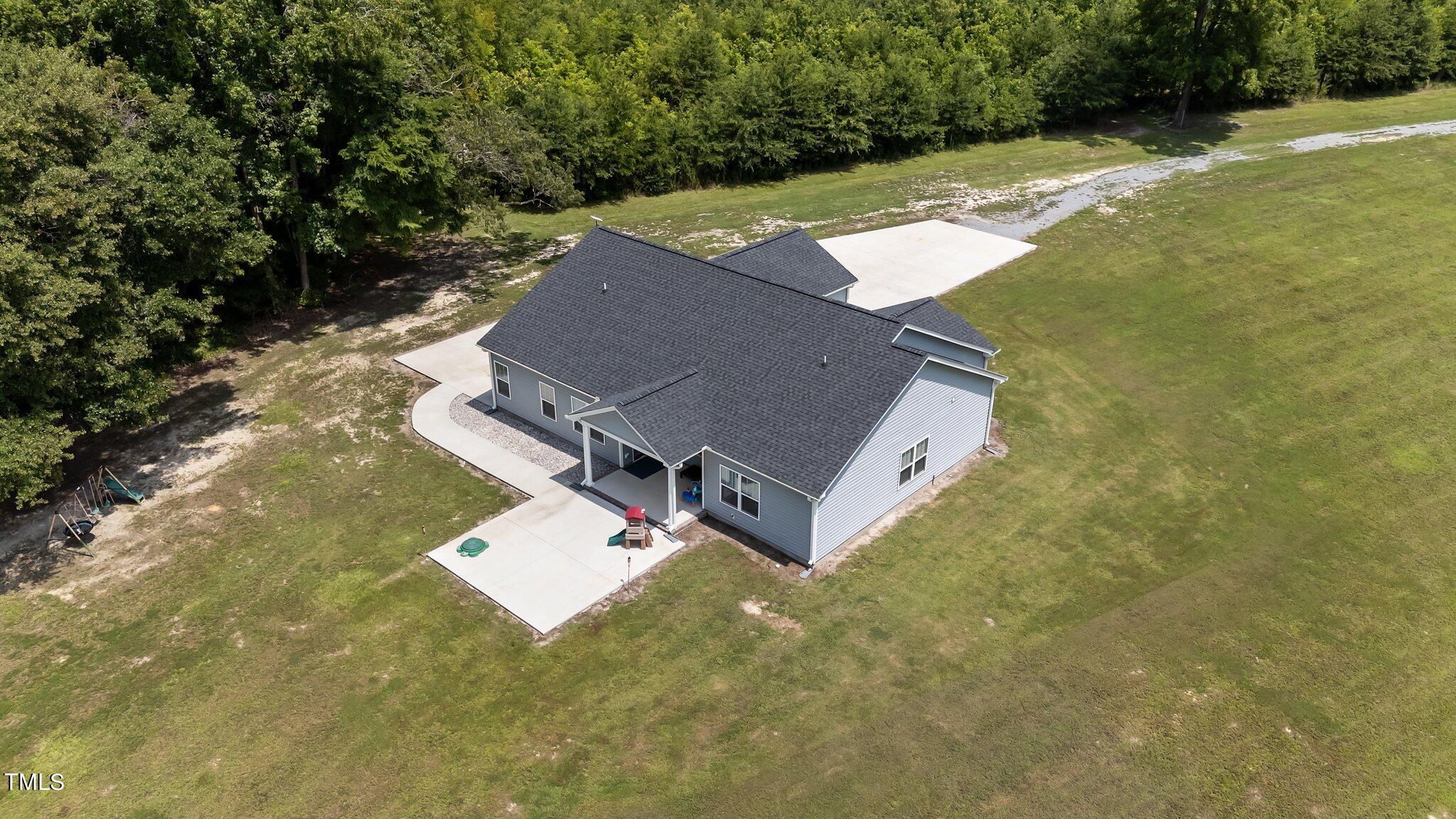 7588 Sadie Road Kenly, NC 27542 - Photo 58 of 58 an aerial view of a house with yard