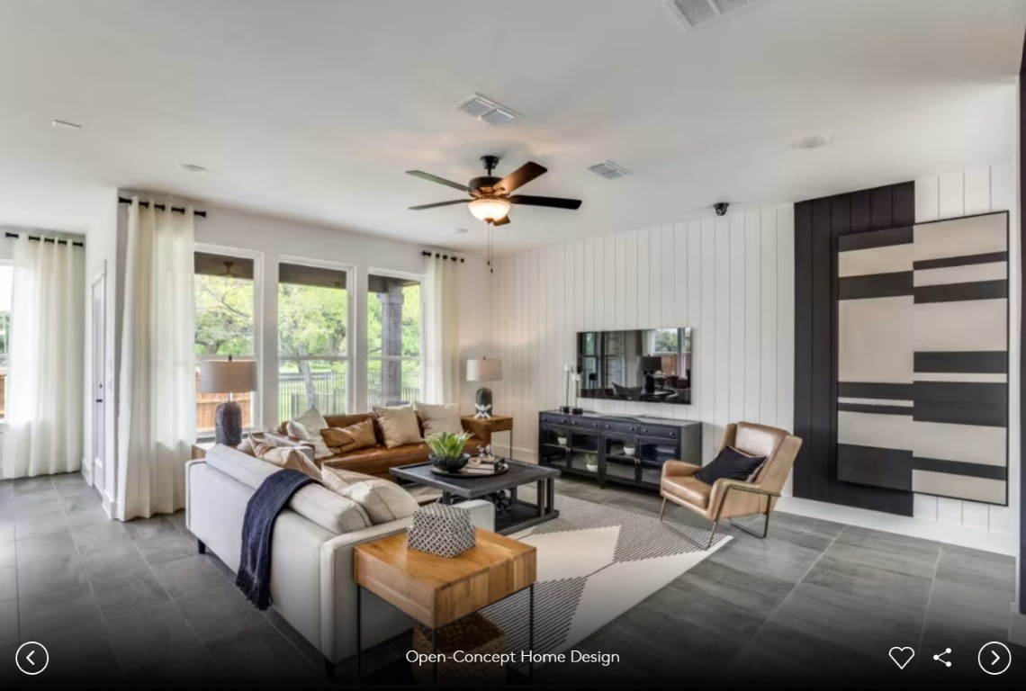 337 Foresail Road Leander, TX 78641 - Photo 6 of 12 a living room with furniture ceiling fan and a flat screen tv