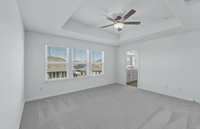 a kitchen with stainless steel appliances granite countertop a sink a stove a refrigerator and island with wooden floor