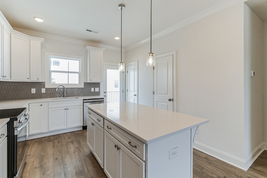 720 Fordham Drive Brentwood, TN 37027 - Photo 12 of 32 a kitchen with white cabinets and white appliances
