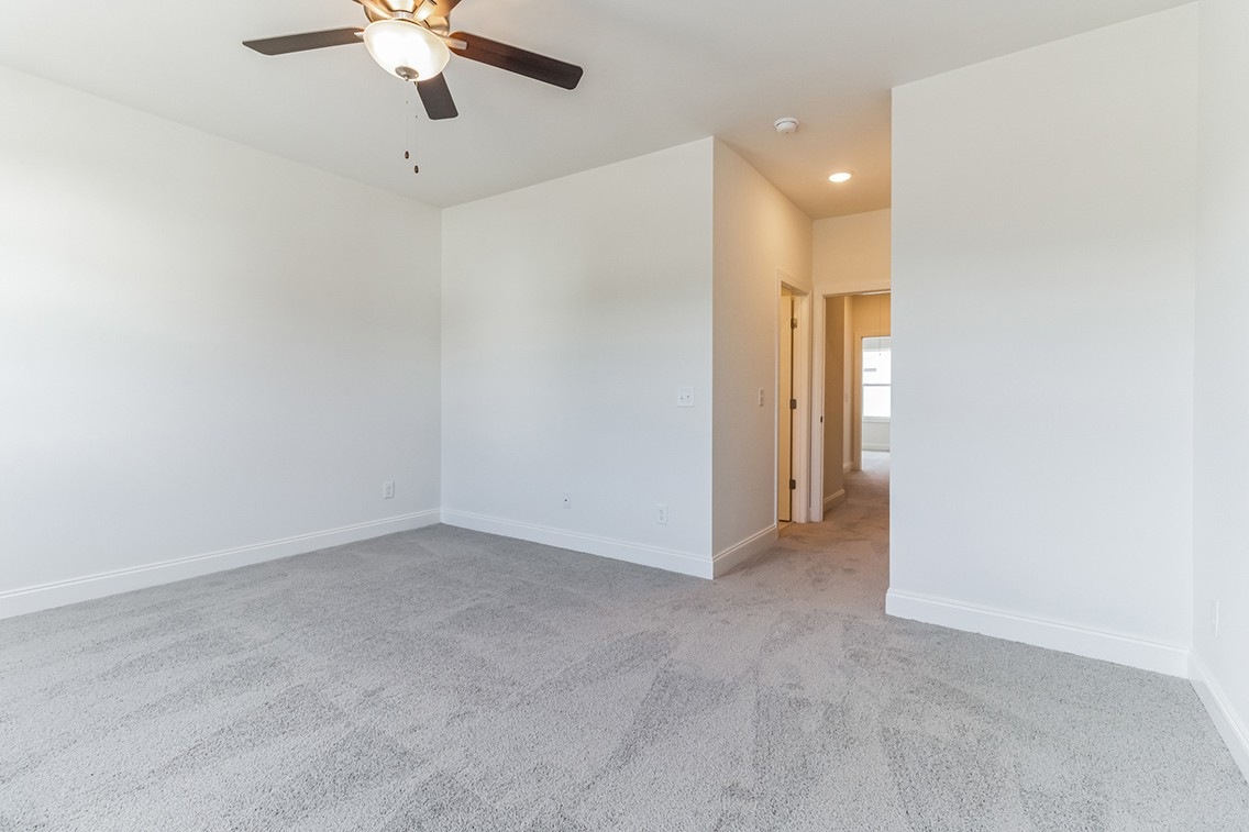 720 Fordham Drive Brentwood, TN 37027 - Photo 14 of 32 wooden floor in an empty room with a chandelier fan