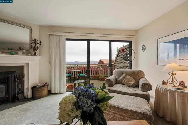 a dining room with furniture and a chandelier
