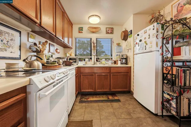 a room with furniture a rug and a painting on the wall
