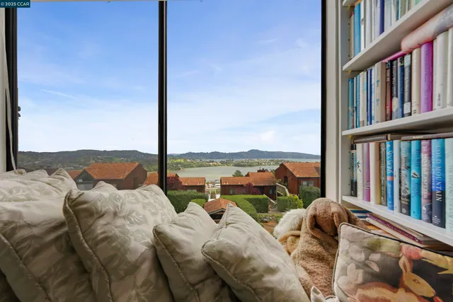 a spacious bedroom with a bed and a desk