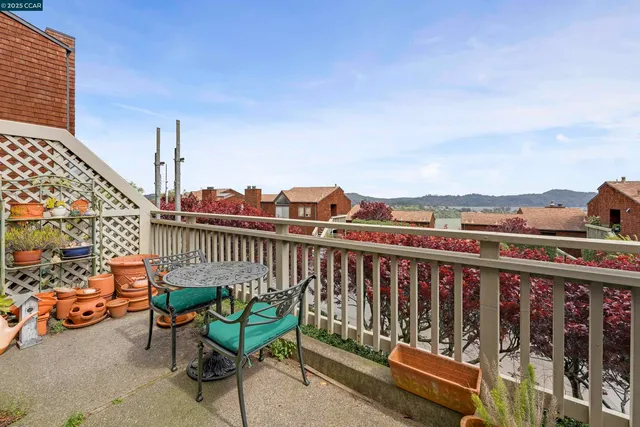 a view of a balcony with chairs